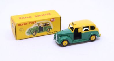 Dinky: A boxed Dinky Toys, Austin Taxi, Reference No. 254, two-tone green and yellow body.