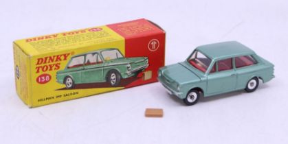 Dinky: A boxed Dinky Toys, Hillman Imp Saloon, Reference No. 138, metallic green, with suitcase.