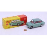 Dinky: A boxed Dinky Toys, Hillman Imp Saloon, Reference No. 138, metallic green, with suitcase.