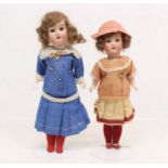 Dolls: A pair of bisque head dolls, comprising: one with open and close eyes, open mouth,