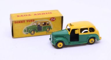 Dinky: A boxed Dinky Toys, Austin Taxi, Reference No. 254, green and yellow body. Original box,
