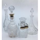 Four various 20th century glass decanters, to include a silver mounted hobnail cut glass decanter,