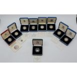 Nine Elizabeth II 1 pound silver proof coins: 1983, 1988, 1989, 1991, 1996, 2000, 2002 together with