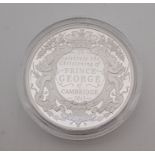 An Elizabeth II 2013 UK Ten pounds (5 ounce) silver proof Christening of Prince George commemorative
