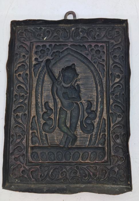 A 20th century Indian cupro-bronze plaquette, with deity to centre, 13.5cm x 9.9cm. - Image 2 of 2