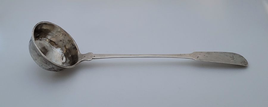 A large 19th century German silver fiddle pattern ladle, length 38cm. (211.4g)