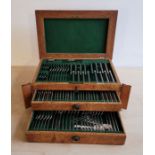 A comprehensive oak cased Walker & Hall silver plated canteen for eight, complete with key.