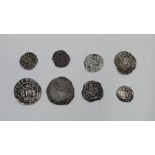 A collection of eight English hammered silver coins, to include: an Edward I (1272-1307) silver