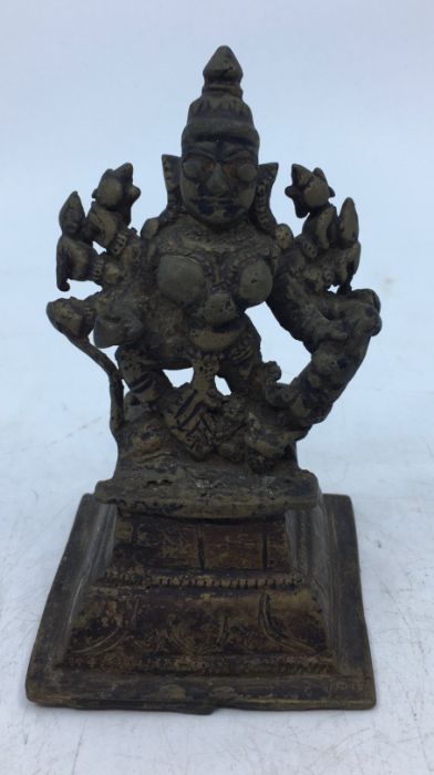 A 19th century Indian bronze figure of an eight armed Durga, height 11.5cm