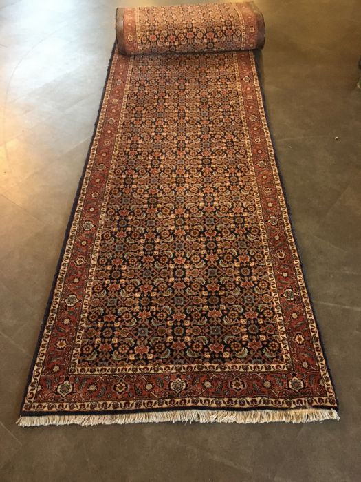 A large Persian runner. 390 x 92cm - Image 2 of 2