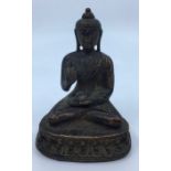 A 20th century Sino-Tibetan bronze figure of seated Buddha, height 12.2cm.