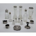 A pair of silver mounted glass posy vases, together with a set of four silver topped cut glass