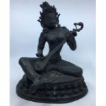 A 20th century Indian bronze figure of Saraswati playing the veena, height 30.5cm
