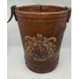 A learther fire bucket, painted with Royal crest to side. height 40cm.