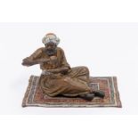 Bergmann:  An Austrian old painted bronze model of a Moor seated cross legged on a carpet drinking