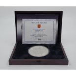 An Elizabeth II 2013 Guernsey ten pounds (5oz.) christening of Prince George commemorative silver