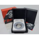 An Elizabeth II UK Music Legends "David Bowie" 10 pounds (5oz.) silver proof coin, rev. David