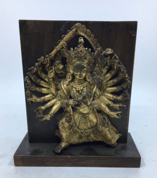 A Sino-Tibetan gilt bronze figure of eighteen armed Durga, late 19th/early 20th century, probably