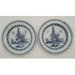 A pair of 18th century Delftware plates, painted in blue, diameter 23.2cm. (2) Condition note: