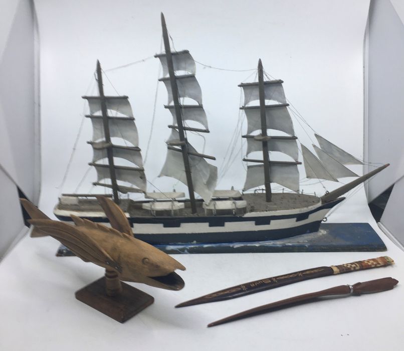 **WITHDRAWN**A model flying fish together with 2 letter knives, together with a model ship (4)