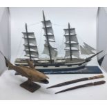 **WITHDRAWN**A model flying fish together with 2 letter knives, together with a model ship (4)