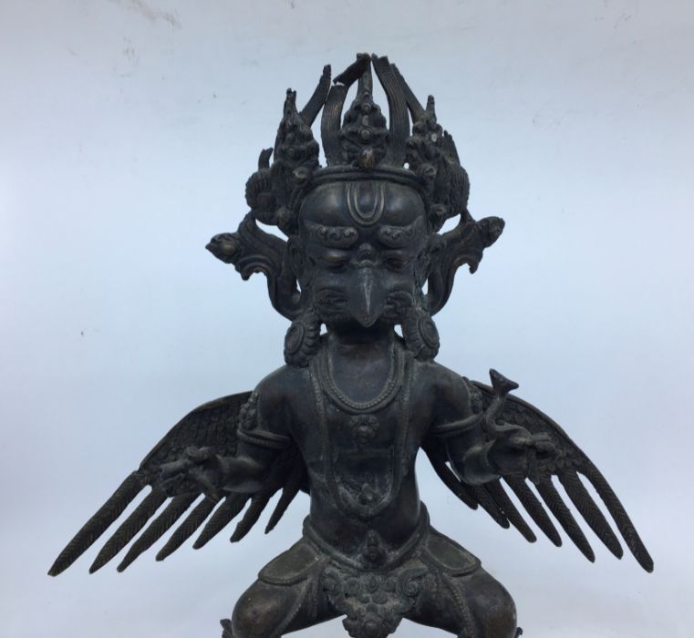 A 20th century Sino-Tibetan bronze figure of standing Garuda, height 35cm. - Image 2 of 5