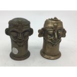Two 19th century East Indian bronze Shiva Lingams, height 10.7cm. (2)
