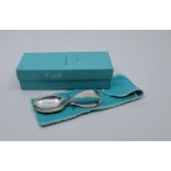 A Tiffany & Co sterling silver "Loop Baby Spoon", in pouch and box, length 9cm.