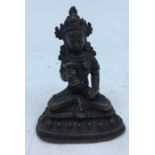 An early 20th century Sino-Tibetan bronze figure of a deity, height 6.2cm.