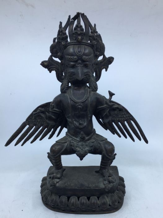 A 20th century Sino-Tibetan bronze figure of standing Garuda, height 35cm.