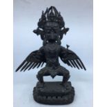 A 20th century Sino-Tibetan bronze figure of standing Garuda, height 35cm.