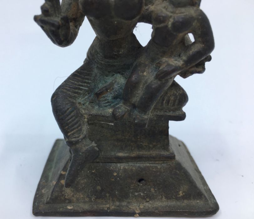 A 19th century (or earlier) Indian bronze figure of a deity with consort, height 7.8cm - Image 3 of 5