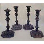 Four silver plated candlesticks, by Elkington & Co, the sconces with inserts for electric light