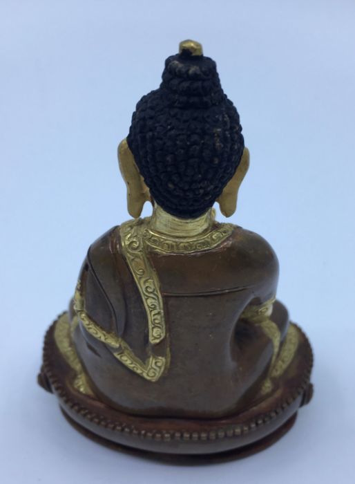 A 20th century Sino-Tibetan gilt and polychrome painted bronze figure of seated Buddha with hands in - Image 4 of 5