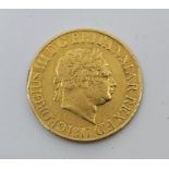 A George III 1817 gold sovereign coin, obv. Laur head right, legend type A, rev. St.George and