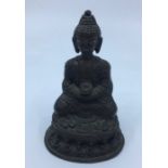 A 20th century bronze figure of seated Buddha, height 10.6cm.