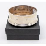 A Modern plain silver wine coaster, turned wooden base, hallmarked by Douglas Pell Silverware,