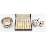 A collection of silver to include: a set of six George V silver and enamel cocktail forks,