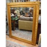 A large 20th Century gilt over mantle mirror/dress mirror with bevelled glass, 154  x 123cm