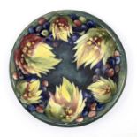 Moorcroft 'Leaf and Berry' pattern bowl designed by Walter Moorcroft. Diameter approx 23cm. Marks to