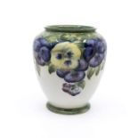 William Moorcroft for Macintyre & Co 'Pansy' pattern vase. Height approx 15cm. Signature and mark to