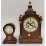 A late 19th century open-face mantel clock, along with an Edwardian mantel clock, both in mahogany