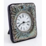 A Modern silver framed desk clock, velvet easel backing, the frame chased with scrolls and