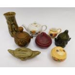 A collection of kitchen wares, including onion pots and celery pots