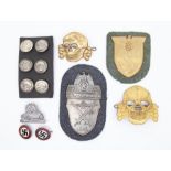A selection of German badges and insignia. To include: a gilt washed ‘Kuban’ shield with paper