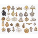 A good selection of WW1/WW2 regimental cap badges / collar badges. Various regiments and corps,