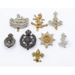 A selection of British Regimental cap badges including a 5th & 6th Battalions Gloucestershire