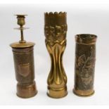 A trio of hand worked WWI era trench art shell cases including a 75mm French example, with hand