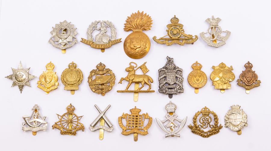 A large selection of British cap badges for various Regiments and Corps, all are likely later