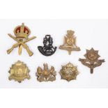 A selection of WWI/inter war British cap badges including a die stamped brass, one piece, School